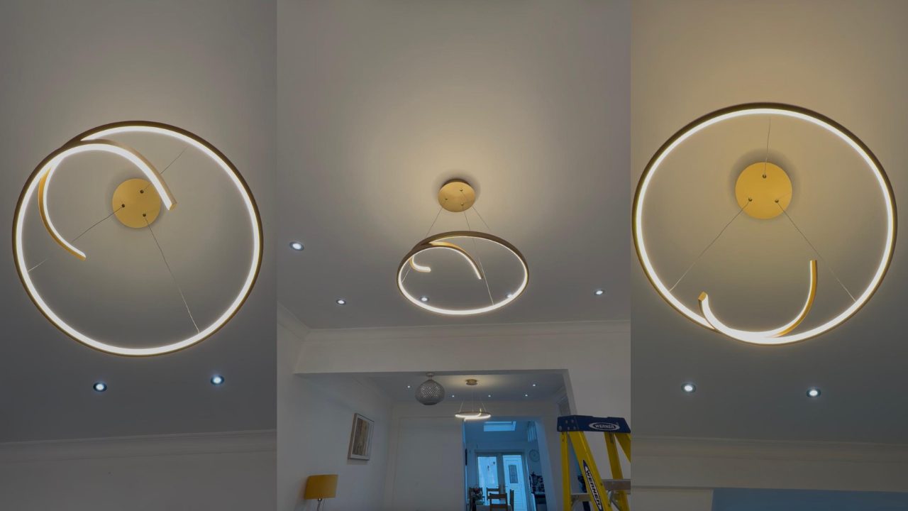 Gold chandelier installed in a living room